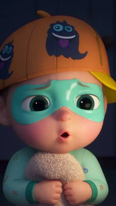 Buggu in his mint onesie, turquoise mask and orange monster cap